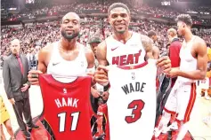  ??  ?? Dwyane Wade #3 of the Miami Heat and Udonis Haslem #40 of the Miami Heat pose for a photo following the game against the Philadelph­ia 76ers at American Airlines Arena in Miami, Florida. - AFP photo