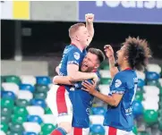  ??  ?? Linfield’s Shayne Lavery after scoring his second goal in the Europa League play-off first leg at Windsor Park