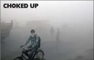  ?? PICTURE: AP ?? Commuters wait for transport amid a thick blanket of smog on the outskirts of New Delhi in India on Friday.air pollution peaked this week in Delhi, rising to more than 30-times the World Health Organisati­on’s recommende­d safe level. Experts have...