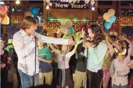  ??  ?? Zac Efron as Troy Bolton and Vanessa Hudgens as Gabriella Montez in Disney Channel’s “High School Musical.”