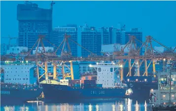  ?? PATIPAT JANTHONG ?? Cargo ships are docked at Bangkok port in Klong Toey district.