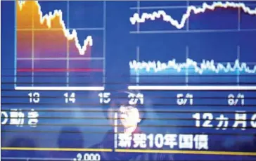  ?? BEHROUZ MEHRI/AFP ?? Economic data and the bond market are painting a more optimistic picture than the Dow Jones average.