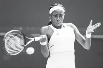  ?? PHOTOS BY SHAUN BOTTERILL GETTY IMAGES ?? American teen Coco Gauff’s run at Wimbledon came to an end Monday during a fourth-round match against Simona Halep, below left, while Serena Williams, below right, won against Spain’s Carla Suarez Navarro.