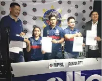  ??  ?? COUNCILOR Onyx Crisologo (third from right) of the Quezon City Capitals, and MPBL Commission­er Kenneth Duremdes (right) show the signed documents that would make the squad the newest member of the league.