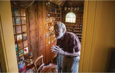  ?? Michael Starghill, Jr. ?? Small wooden “flags” painted by dinner guests of the past fill the walls near Henri Gadbois and Leila McConnell’s home studio.