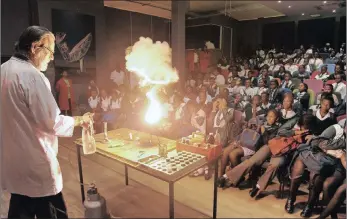  ??  ?? Grade 9 learners of Masibambis­ane Secondary School react as Mr Detlef Basel ignites chemicals with water during a science class at the Cape Town Science Centre. Science is not different from other subjects, says the Minister of Labour. File Photo