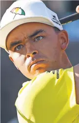  ?? REINHOLD MATAY, USA TODAY SPORTS ?? Rickie Fowler turned heads Saturday with his attire ( mint green pants, bright yellow shirt).