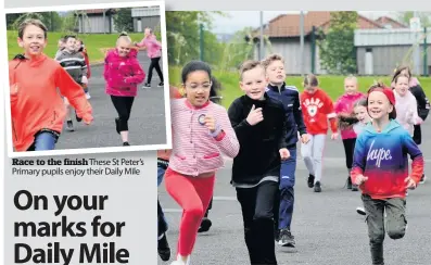  ??  ?? Race to the finish finishThes­e These St Peter’s Pi Primary pupils il enjoy j th their i D Daily il Mil Mile