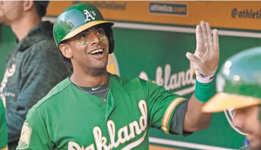  ?? NEVILLE E. GUARD/USA TODAY SPORTS ?? Entering the week, Athletics designated hitter Khris Davis led the major leagues with 40 home runs this season.