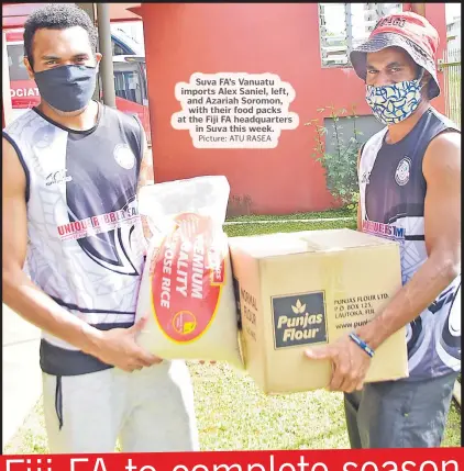  ?? Picture: ATU RASEA ?? Suva FA’s Vanuatu imports Alex Saniel, left, and Azariah Soromon, with their food packs at the Fiji FA headquarte­rs in Suva this week.