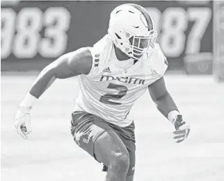  ?? SUSAN STOCKER/SOUTH FLORIDA SUN SENTINEL practice. He had 13 sacks a year ago at ?? Miami defensive lineman Quincy Roche runs through a drill during Temple and UM’s lone sack against UAB in the season opener.