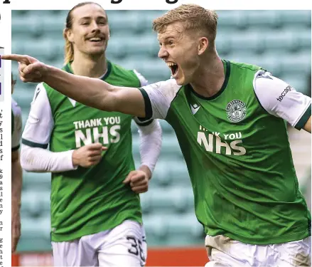  ??  ?? Heading for the summit: Josh Doig celebrates his goal with team-mate Jackson Irvine