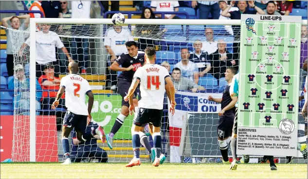  ?? PICTURES: Action Images ?? NO WAY THROUGH: Derby County’s Jason Shackell heads the ball off the line to help keep Bolton at bay