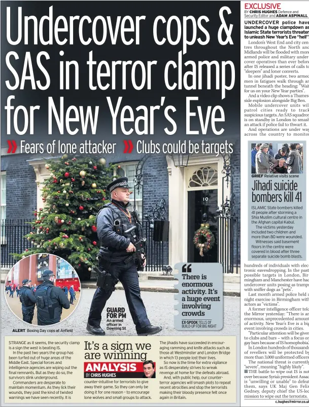  ??  ?? ALERT Boxing Day cops at Anfield GUARD FOR PM An armed officer in Downing St