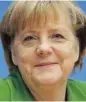 ?? SEAN GALLUP/GETTY IMAGES ?? German Chancellor Angela Merkel talks to reporters about Wednesday’s deal that will make a new coalition government possible.