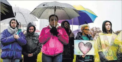  ?? Alexandra Wimley ?? The Associated Press Attendees stand during a moment of silence Friday at the rally for peace and Tree of Life victims at Point State Park in Pittsburgh.
