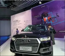  ?? ZHANG DANDAN / CHINA DAILY ?? Audi showcases an electric Q7 SUV at the 2019 China Internatio­nal Import Expo in Shanghai.