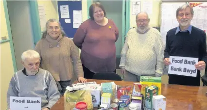  ??  ?? Volunteers at Amlwch’s Pantri No.6 Foodbank which will be open Wednesdays 11am-3pm. Ray Jones, Alix Warren, Bronwen Westlake, Roger Westlake and Gordon Warren