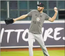  ?? Karen Warren / Houston Chronicle ?? Red Sox starting pitcher Chris Sale warms up during batting practice on Wednesday in Houston.