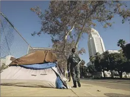  ?? Al Seib Los Angeles Times ?? AN ENCAMPMENT near City Hall last year. “I’ve always felt it’s an emergency if you have 40,000 people on the street,” incoming Mayor Karen Bass said Friday.