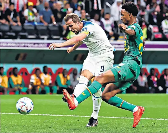  ?? ?? Power and precision: Harry Kane drives home England’s second goal