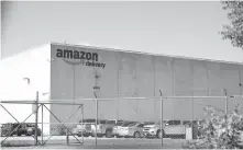  ?? PHIPPS/ THE OKLAHOMAN] ?? Amazon moved into a 312,120-square-foot mega warehouse, nearly 20 years old but retrofitte­d, at 6801 S Air Depot Blvd., in June. [SARAH