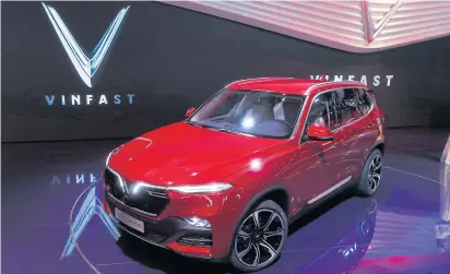  ?? EPA-EFE ?? A LUX SA 2.0 SUV is displayed at the stand of the Vietnamese carmaker VinFast Trading and Production LLC at the Paris Motor Show on Tuesday.