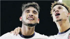  ?? (Photos: AFP) ?? Ricardo Pepi (left) of United States celebrates with teammate Antonee Robinson after scoring against Jamaica in the second half of a 2022 World Cup Qualifying match at Q2 Stadium in Austin, Texas, yesterday.