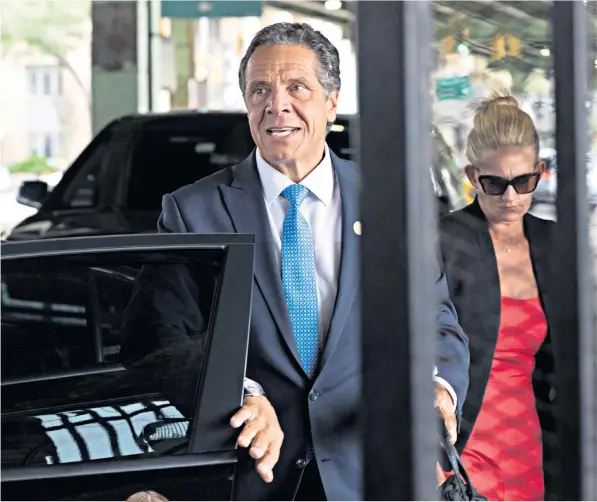  ??  ?? Andrew Cuomo after announcing his resignatio­n. Left, former aide Brittany Commisso, one of the women who have alleged they were sexually harassed by him