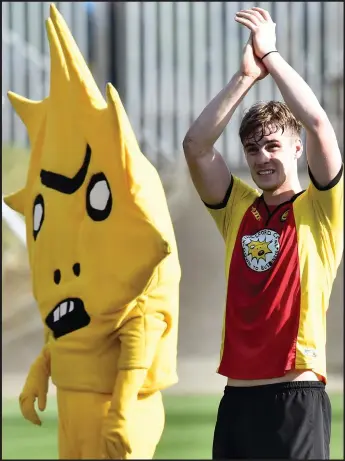  ??  ?? Kingsley and I...Liam Lindsay joins Thistle’s mascot for a clap of honour at full-time after top six is won