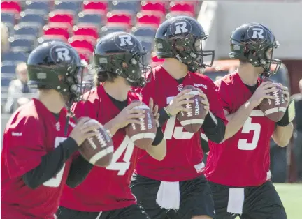  ?? PAT McGRATH / OTTAWA CITIZEN ?? Ottawa Redblacks quarterbac­ks Jordan Johnson, Alex Carder, Brock Jensen and Danny O’Brien, left to right, practise during the spring mini-camp held at TD Place stadium on Wednesday. The Redblacks also have Thomas DeMarco and Henry Burris at the position.