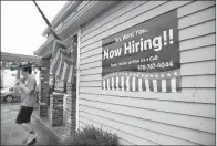  ?? AP/ELISE AMENDOLA ?? A restaurant in Middleton, Mass., advertises for help last month. People applying for unemployme­nt benefits fell last week.