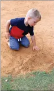  ??  ?? Two-year-old Lawson Steele, of Goodman, isn’t afraid to get dirty and is willing to prove it. Steele and his family took a break from the Third of July festivitie­s to create art in the ballfields.