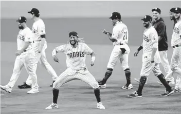  ?? K.C. ALFRED U-T ?? Padres’ Fernando Tatis Jr. celebrates 4-0 win over the St. Louis Cardinals on Friday night at Petco Park.