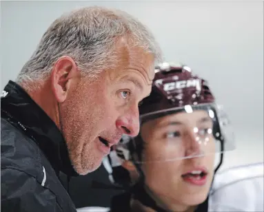  ?? CLIFFORD SKARSTEDT EXAMINER ?? Peterborou­gh Petes head coach Rob Wilson goes over a play with centre Semyon Der-Arguchints­ev during an Aug. 30 practice at the Evinrude Centre. SDA is returning to the Petes lineup for Thursday night’s game with the Niagara IceDogs after spending three weeks at the Toronto Maple Leafs training camp. Wilson considers SDA the team’s most talented offensive player.