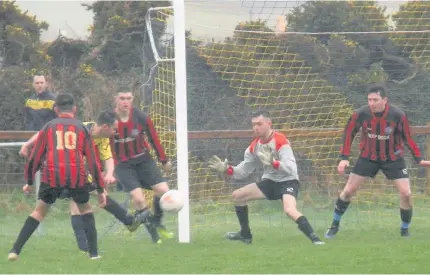  ??  ?? Aberffraw (yellow) on the attack against Beaumaris Town