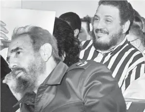  ?? — Gambar AFP ?? GAMBAR fail Februari 2002 menunjukka­n Fidelito di belakang Castro.