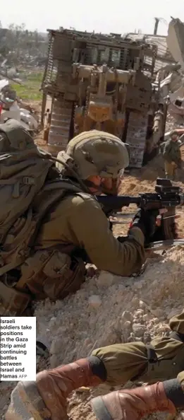  ?? AFP ?? Israeli soldiers take positions in the Gaza Strip amid continuing battles between Israel and Hamas