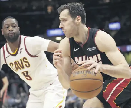  ?? ASSOCIATED PRESS FILE PHOTO S ?? Miami Heat’s Goran Dragic, right, is taking up golf during his downtime inside the NBA’S bubble at the Walt Disney World in Florida.