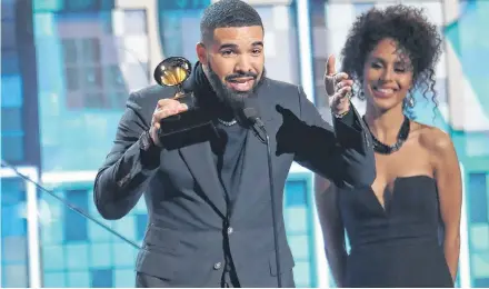  ?? AP PHOTO ?? Drake accepts the award for best rap song for “God’s Plan” at the 61st annual Grammy Awards on Sunday in Los Angeles.