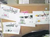  ??  ?? RIGHT Racing car drawings are displayed at the campus workshop of the Osaka University formula racing club.