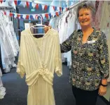  ?? PHOTO: DANIEL BIRCHFIELD ?? Vintage . . . Iona Enliven Care Home activities coordinato­r Diane McCone with a wedding dress worn in 1920.