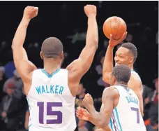  ?? KATHY WILLENS/ASSOCIATED PRESS ?? Charlotte Hornets guard Kemba Walker, forward Dwayne Bacon and center Dwight Howard, seen here celebratin­g a win against the Brooklyn Nets in March, are among the players on the team’s roster.