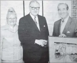  ?? ?? 1984: Fifteen years of service as a charge nurse at the Argyll and Bute Hospital, Lochgilphe­ad, were marked with a presentati­on to Mr Archie MacAlliste­r at the hospital last week. Our picture shows Mr MacAlliste­r (right) with Dr Lamont MacNab, who handed over a painting on behalf of the staff. Also in the picture is Mrs MacAlliste­r.