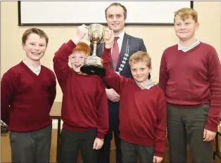  ??  ?? Happy smiles from St. Colman’s Boys School pupils Paddy Duggan, Eoghan O’ Keeffe, Matthew Deady and Naglis Vaitada who were the overall winners in the IRD Duhallow Primary Schools Public Speaking Competitio­n. The boys were presented with their prizes by Councillor Gearóid Murphy who is a member of the IRD Board.