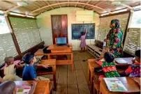  ?? — AFP ?? Floating schools in Bangladesh help children learn in areas devastated by climate change.