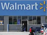  ?? AP FILE ?? Walmart on Tuesday announced a plan to settle lawsuits filed by state and local government­s over the toll of prescripti­on opioids sold at its pharmacies.