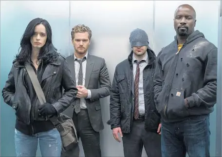  ?? Sarah Shatz Netf lix ?? KRYSTEN RITTER, left, Finn Jones, Charlie Cox and Mike Colter play superheroe­s who band together in “The Defenders” on Netflix.