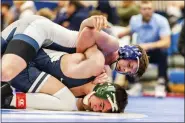  ?? NATE HECKENBERG­ER - FOR MEDIANEWS GROUP ?? Hill School’s Rob Pavlek works on top against Episcopal’s Fernando Loor in a 4-2 win in the 132-pound consolatio­n final.