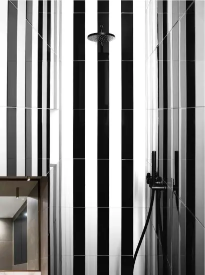  ??  ?? This page, from left Interior designer Roselind Wilson uses graphic stripes alongside taps by The Watermark Collection. Vertical lines are used to elongate a shower space